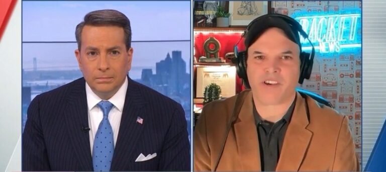 Television screen showing news anchors and ICE footage