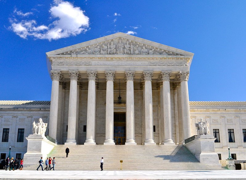 Supreme Court building with American flag