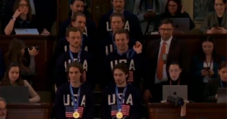 U.S. men's hockey team entering the House chamber with gold medals