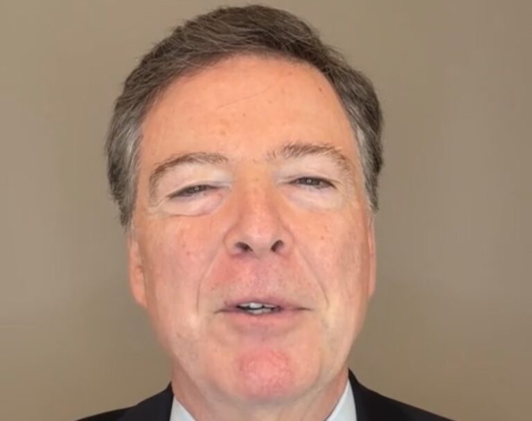 James Comey speaking, gesturing in a video message