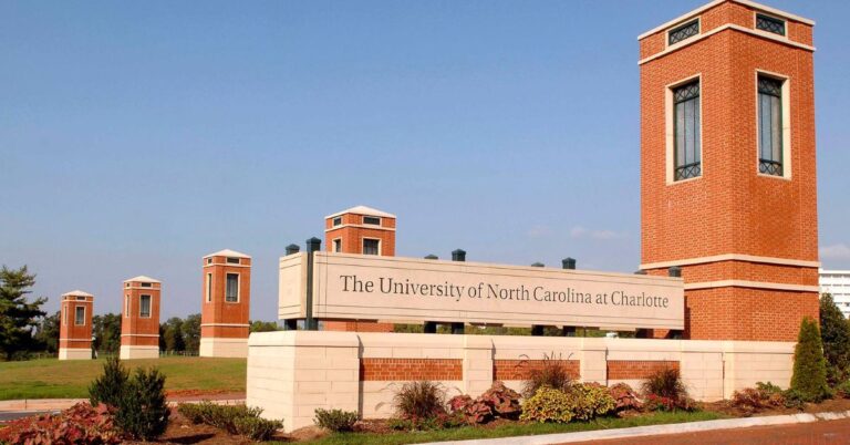 Students walking near a university building on a campus in North Carolina