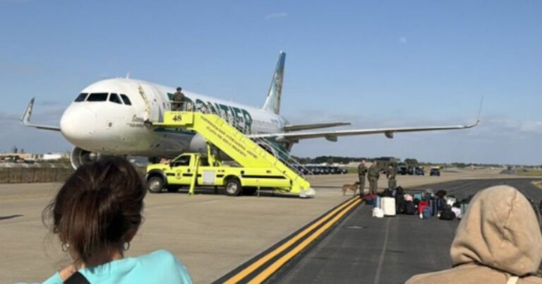 Frontier plane isolated on runway after security response