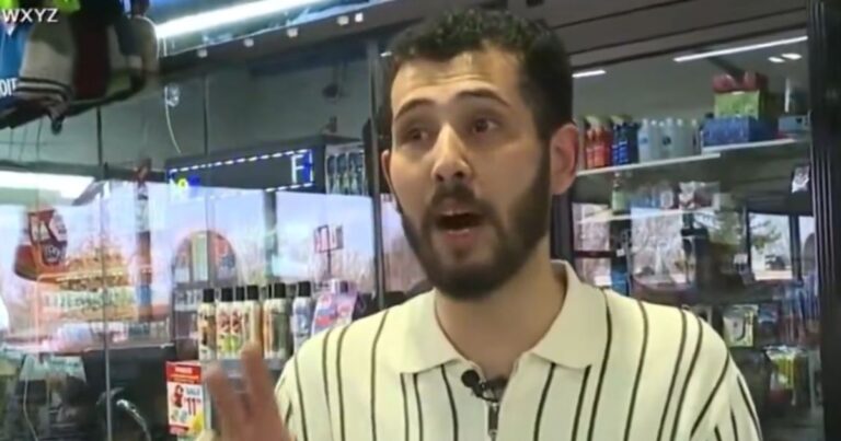 Gas station clerk outside a convenience store after helping police rescue a kidnapped teen