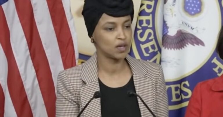 Ilhan Omar speaking at a press event as a viral clip resurfaces