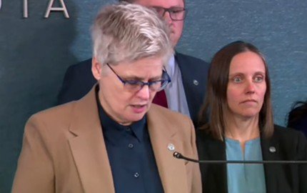 Minnesota prosecutor announces charges against an ICE officer