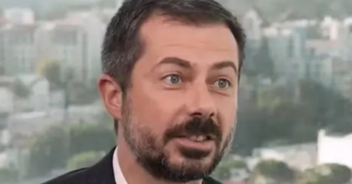 Pete Buttigieg speaking at a podium