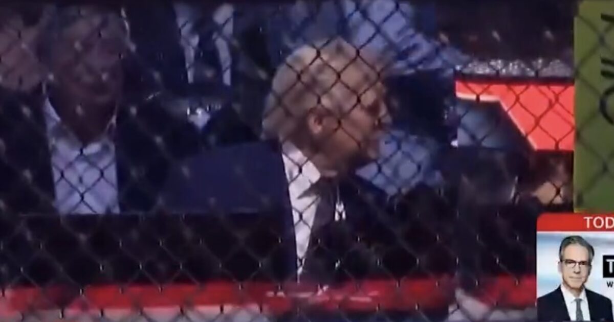 Trump at a UFC event as Josh Hokit hands him a chain