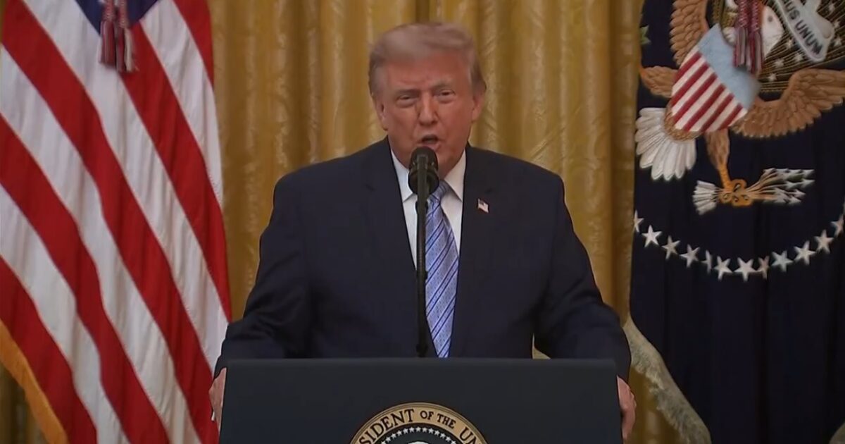 Television cameras aimed at a presidential podium before a national address