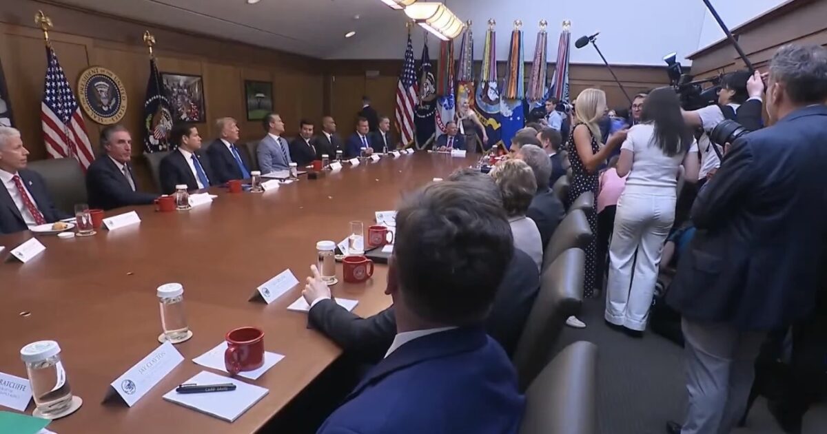 President Trump speaking during a cabinet meeting as reporters ask questions