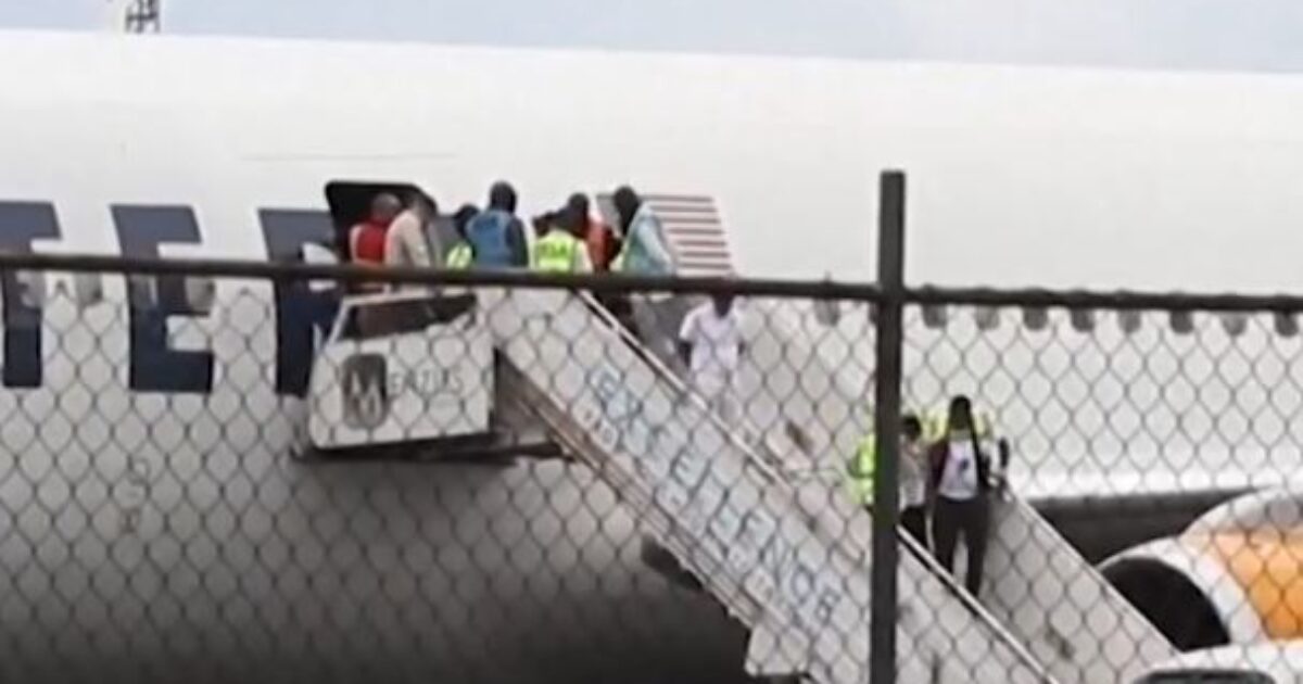 Deportation flight on airport runway