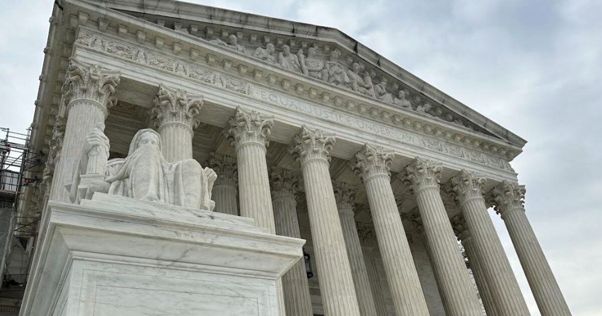 U.S. Supreme Court building with American flag