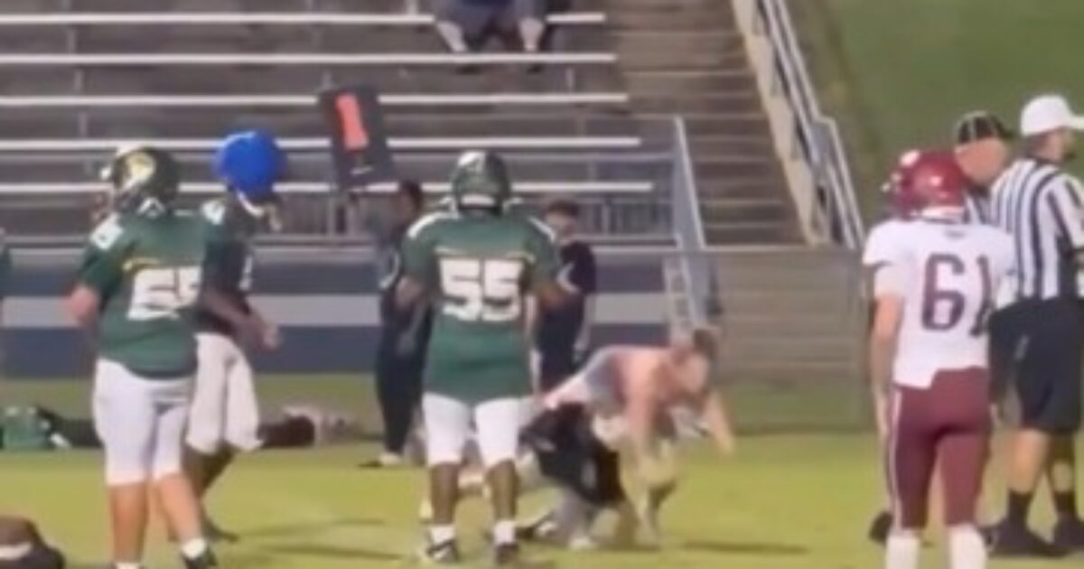 Tennessee middle-school football field during a game where a teen girl ran onto the field