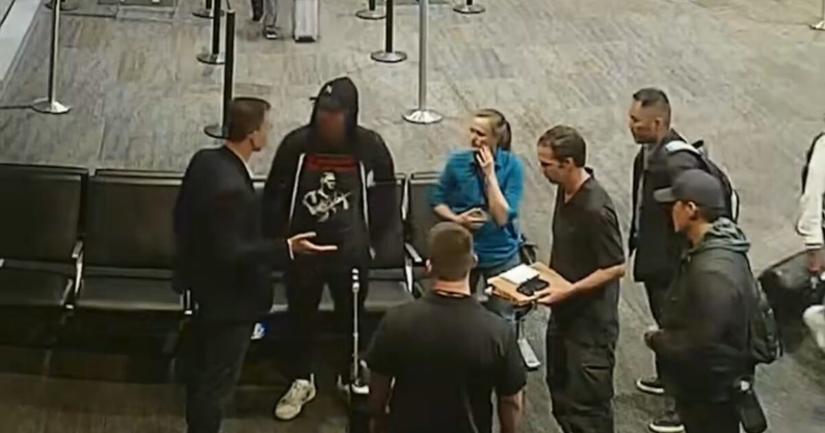 FBI agents approach Eric Swalwell at San Francisco International Airport